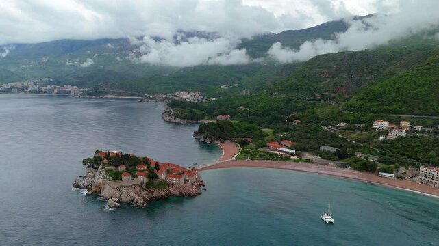 Aerial drone view Sveti Stefan Budva Kotor Montenegro Adriatic Sea Mediterranean Medieval town blue sea water Vacation Holiday Europe 