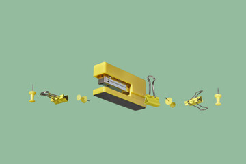 Yellow-colored school stationery on green background