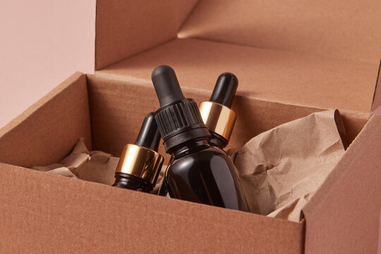 Glass bottles lying in cupboard box