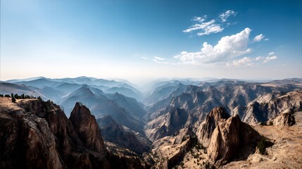 Obraz premium Panoramic view of the mountains in a natural setting under bright sky