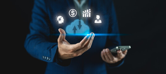 A businessperson interacts with cloud computing icons, representing technology, finance, analytics, and connectivity.