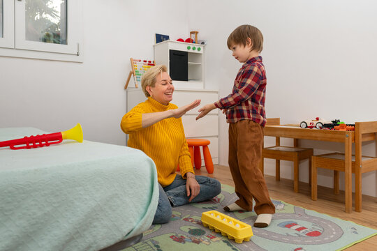 Mother encouraging social skills in autistic son