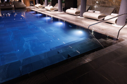 Partial view of spa club with swimming pools and comfortable loungers