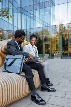 Sales manager demonstrating sales performance review to boss outdoors