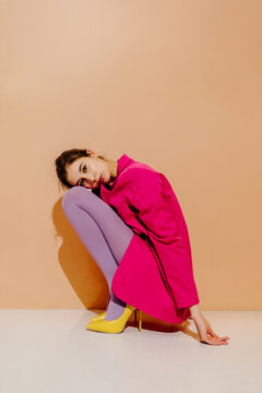 Model in Bright Tights in Bold Fashion Pose