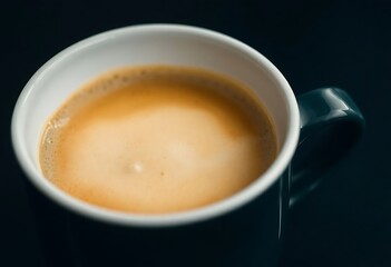 Fototapeta premium close up of a cup of coffee on a table