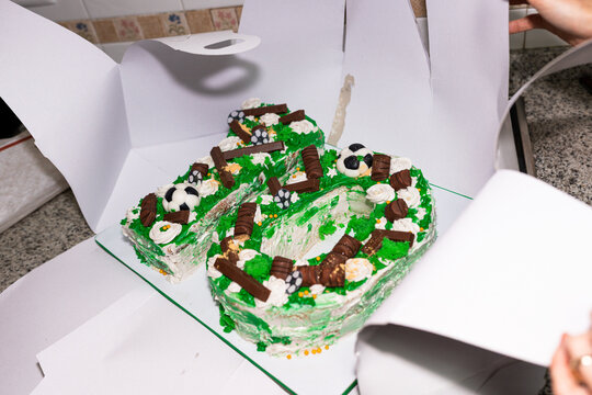 Number ten shaped birthday cake decorated with soccer theme
