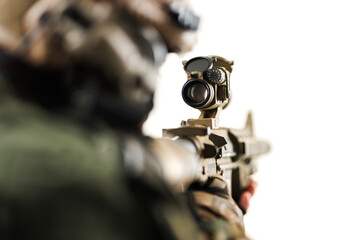Closeup of Tactical Weapon With Optical Scope Held by Camouflaged Soldier