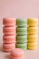 Fototapeta premium Colorful Macarons Stack on Pink Background