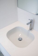 Fototapeta premium white bathroom sink with a chrome faucet