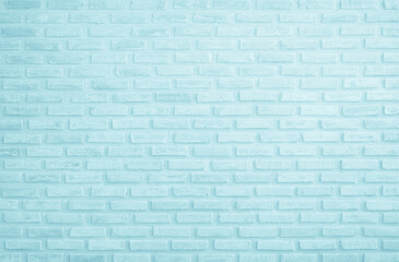 Brick wall painted with pale blue paint pastel calm tone texture background. Brickwork and stonework flooring interior rock old pattern clean concrete grid uneven bricks design stack backdrop.