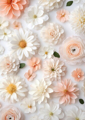 Delicate paper flowers in soft peach and white, arranged on a white background