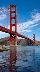 Obraz premium Golden Gate Bridge over the water on a sunny day. Possible use stock photography
