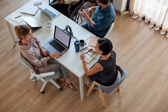 Colleagues talking at work