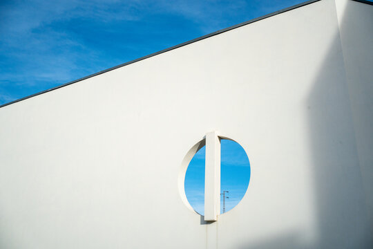 Modern white building with circular cutout