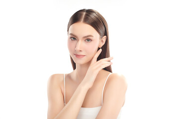 Naklejka premium A beautiful young woman with clean, fresh skin against a white background. Skincare, facial treatment, cosmetology, beauty, and spa. An elegant portrait of an woman.