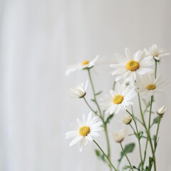 Obraz premium Elegant Arrangement of Pure White Flowers in a Simple Vase Set Against a Soft White Background