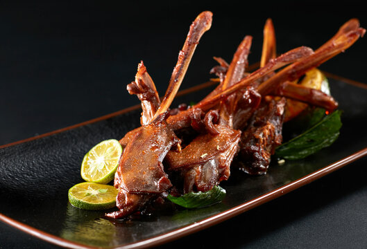 Closeup of braised duck head on a plate