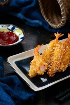 Closeup of fresh fried shrimp on dark table