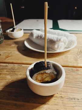 Sushi in a bowl and hand towels