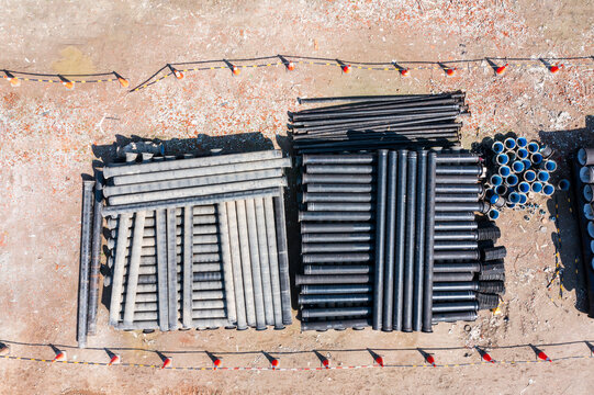 Stacked Pipes and Conduits at Construction Site