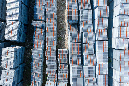Aerial Stacked Industrial Metal Gratings in Outdoor Storage
