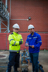 Plumbers and inspectors work together to verify that high pressure relief valves are still operating according to standards.