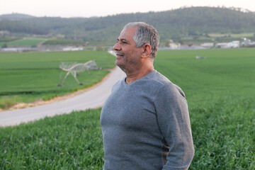 Man Enjoying the Serene Landscape in a Rural Setting at Dusk