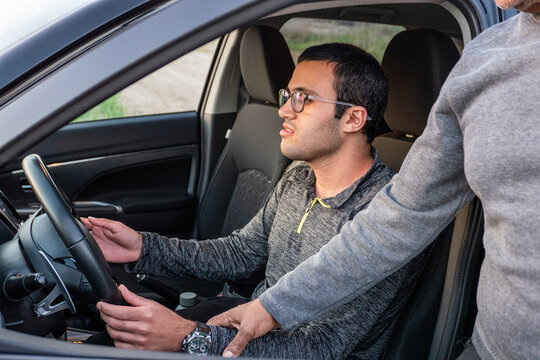Young Driver Receiving Guidance During Practice Session