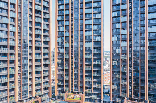 Modern Residential Building Facade with Balconies and Glass
