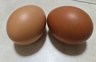 two eggs isolated on white, fresh chicken couple eggs together, eggs on white table