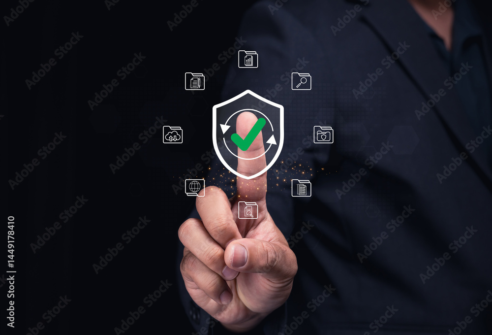 Poster a businessman touches a virtual shield icon with a green checkmark, symbolizing cybersecurity and da