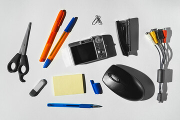 Collection of retro office supplies and gadgets on white background. 