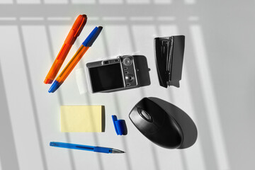 Collection of retro office supplies and gadgets on white background. 
