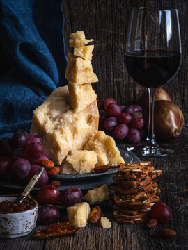 still life with parmigiano reggiano cheese and grapes
