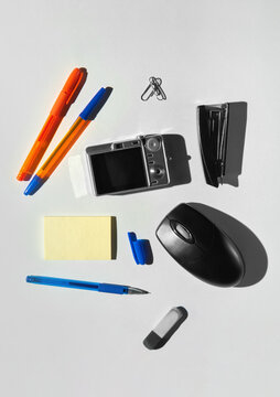 Collection of retro office supplies and gadgets on white background. 