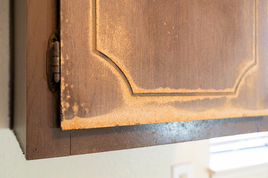 damaged wood cabinet