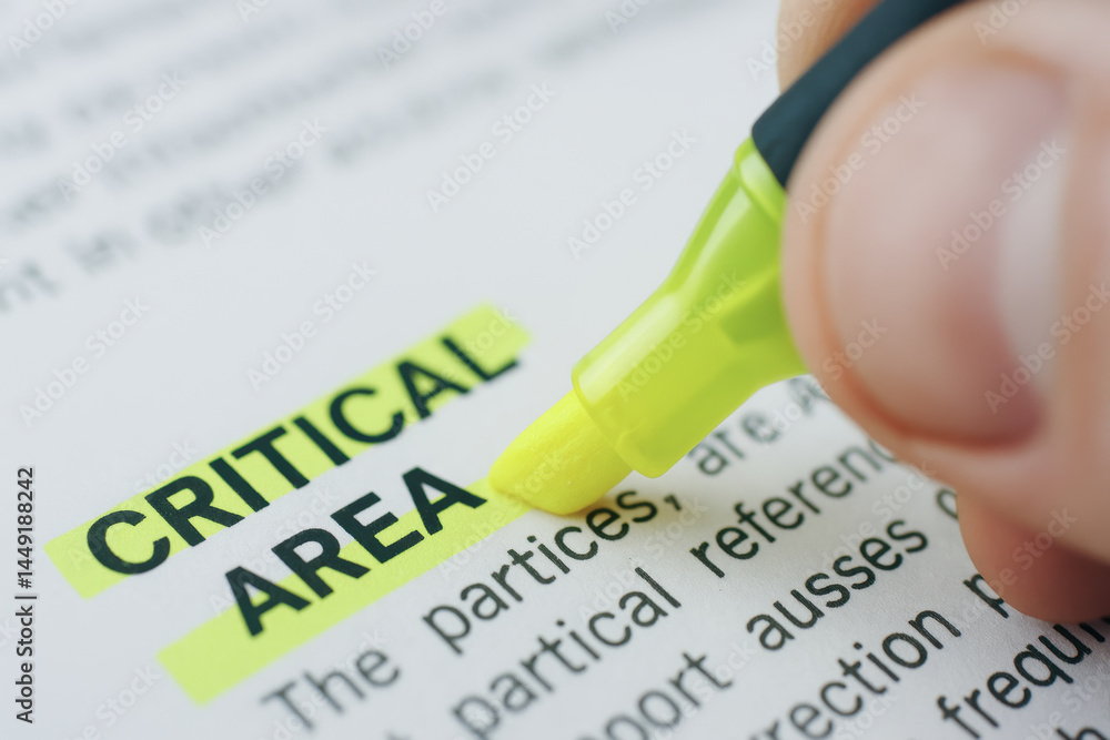 Aufkleber critical area highlighted with yellow marker on paper for mechanical consulting focus and attention 