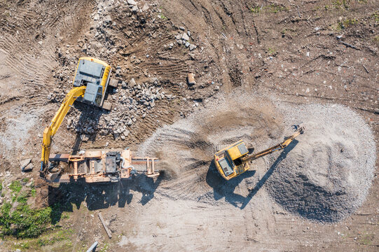 Aerial View of Crusher and Two Excavators on a Construction Site