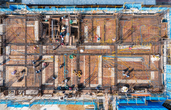 Aerial View of Wiring Construction on a Building's Steel Framework.