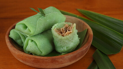 Dadar Gulung, traditional Indonesia sweet crepe roll filled with grated coconut and palm sugar...