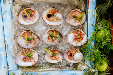 Fresh seafood on ice with vibrant garnishes