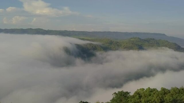 Fly above the clouds in sunrise moment