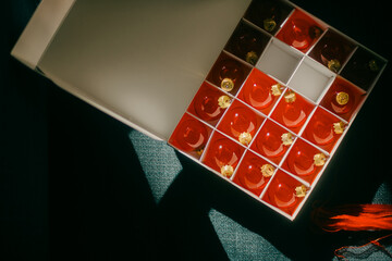 Box of red Christmas ornaments