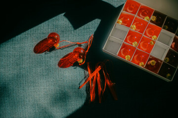 Box of red Christmas ornaments