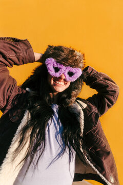Expressive portrait of woman with fuzzy sunglasses