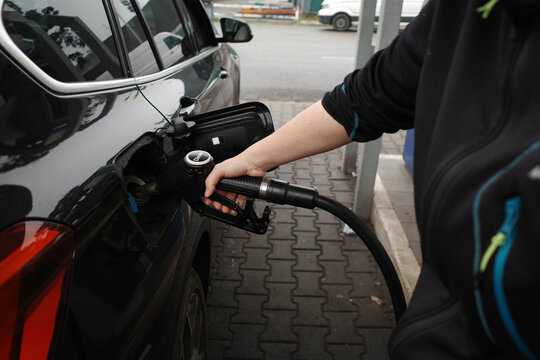 Unrecognizable woman filling up car with diesel