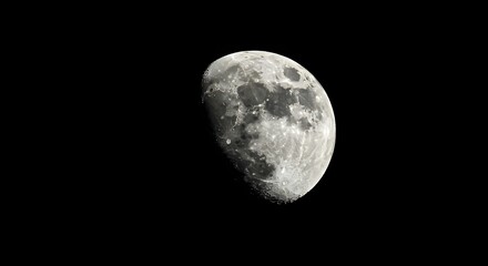 Naklejka premium Waxing Gibbous Moon Close-up View Against Black Sky