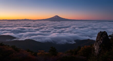 Mountain Peak Rising Above Clouds at Sunrise