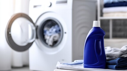 Laundry detergent bottle in a bright laundry room with washing machine and clean towels